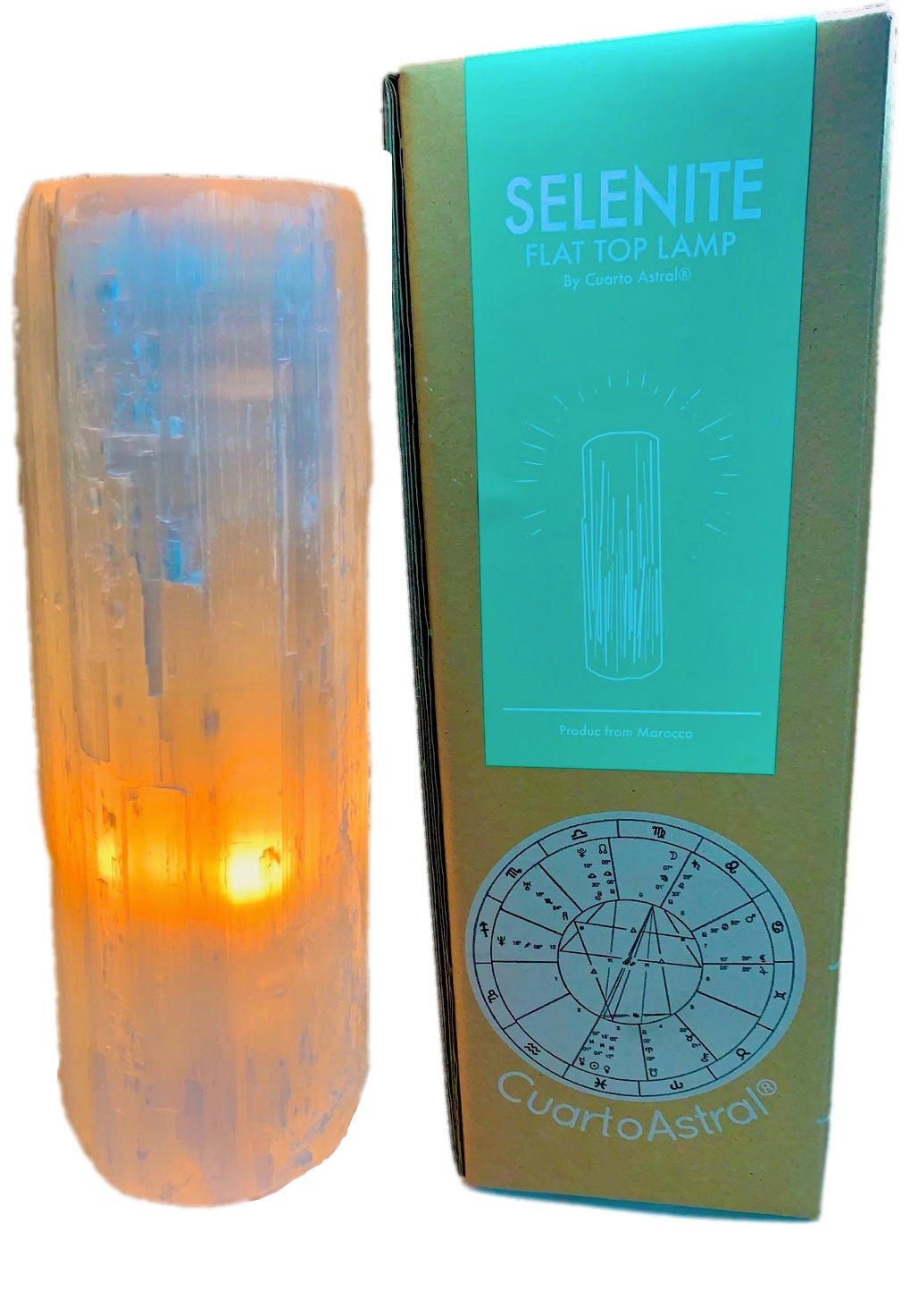 Selenite lamp with glowing interior next to its packaging box on a white background