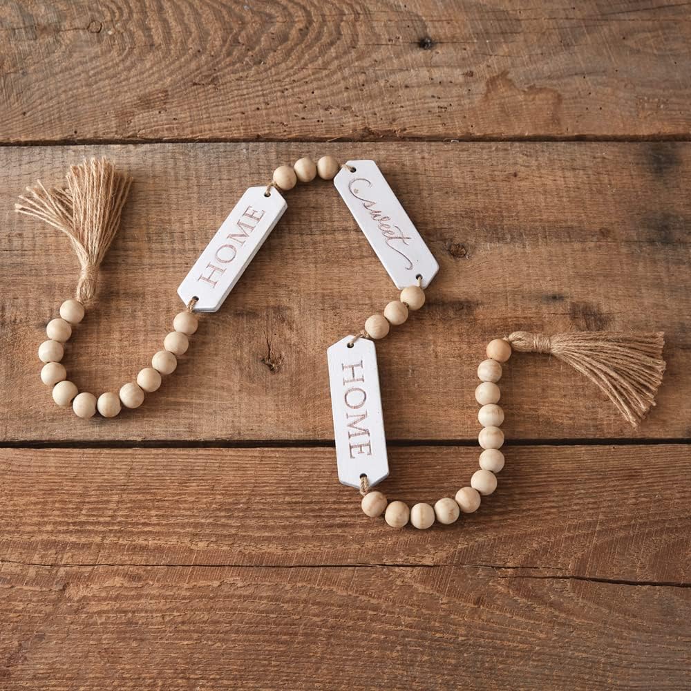Wooden beaded necklace with engraved tags on a wooden surface