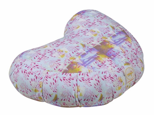 Heart-shaped pillow with colorful floral pattern on a white background
