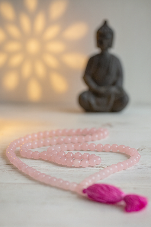 rose quartz mala in spa setting